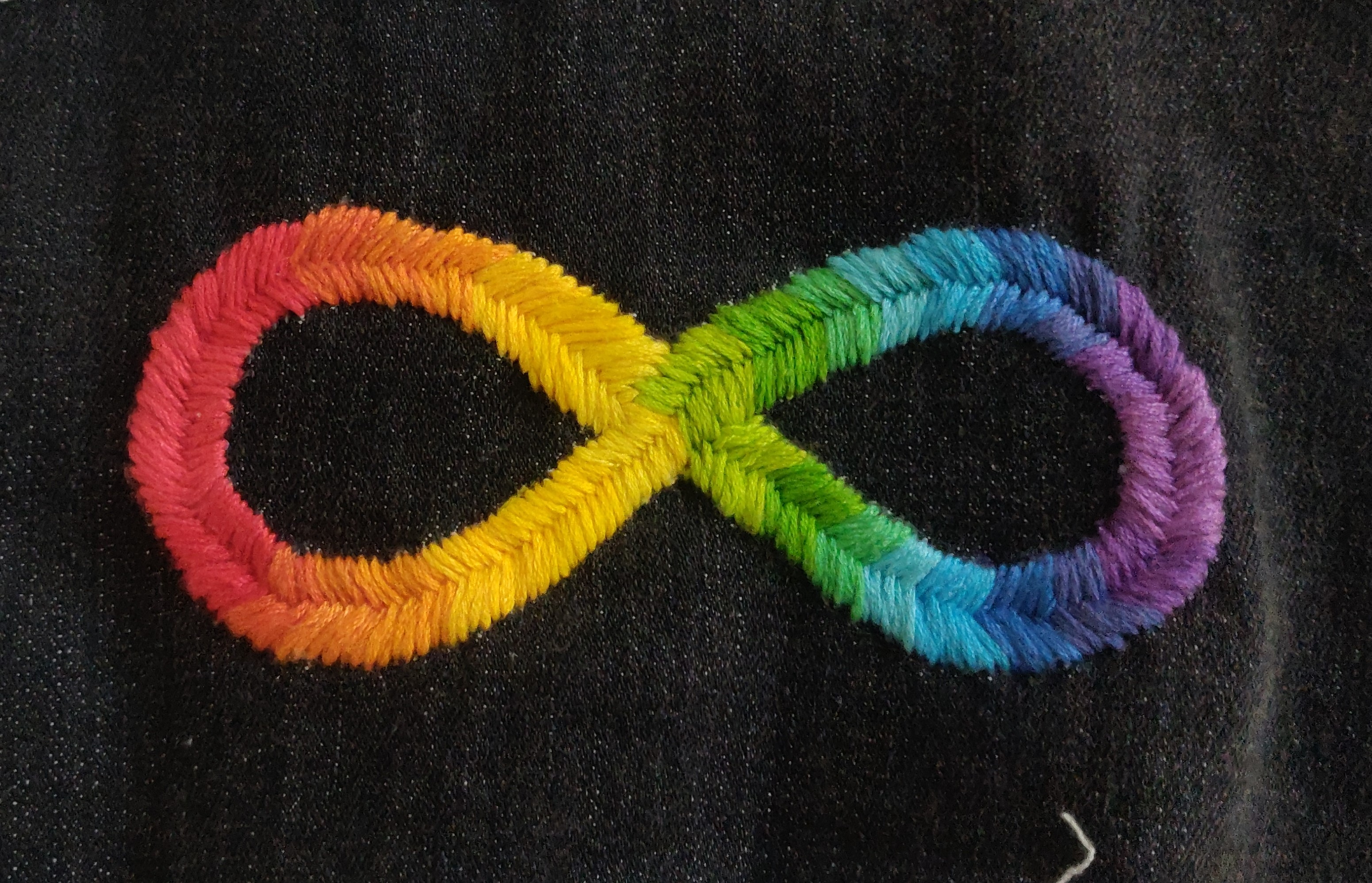 A rainbow infinity symbol.